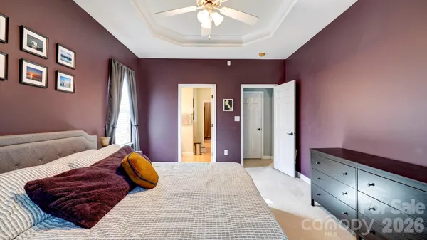 a bedroom with furniture and a chandelier