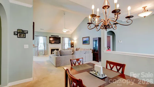 a view of a livingroom with furniture and a chandelier