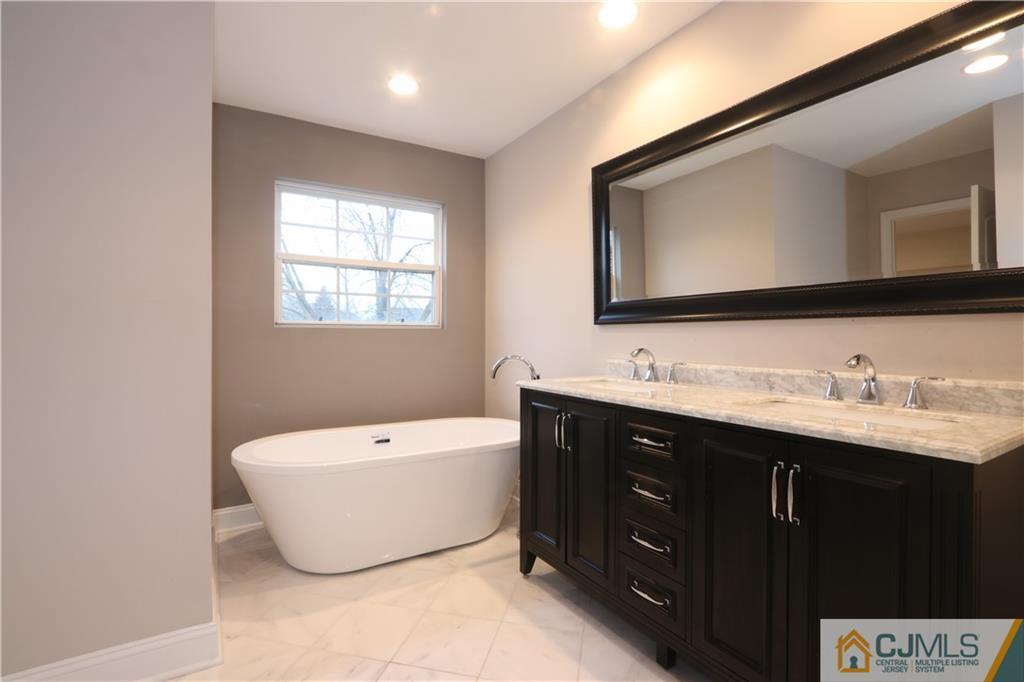 185 Nebula Road Piscataway, NJ 08854 - Photo 15 of 20 a spacious bathroom with a double vanity sink mirror and bathtub
