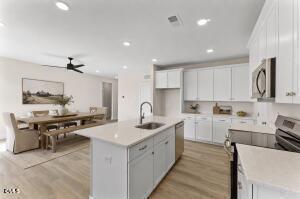 2760 River Meadow Spring Hope, NC 27882 - Photo 2 of 42 a kitchen with a sink stove and cabinets