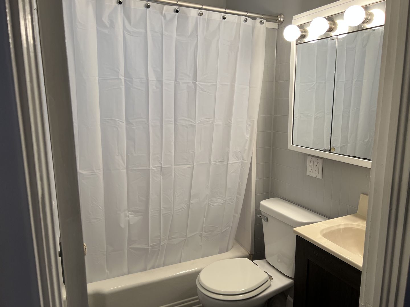 252 Ottawa Road Paxton, IL 60957 - Photo 7 of 14 a white toilet sitting next to a shower