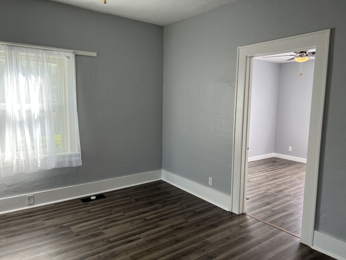 252 Ottawa Road Paxton, IL 60957 - Photo 9 of 14 a view of an empty room with wooden floor and a window