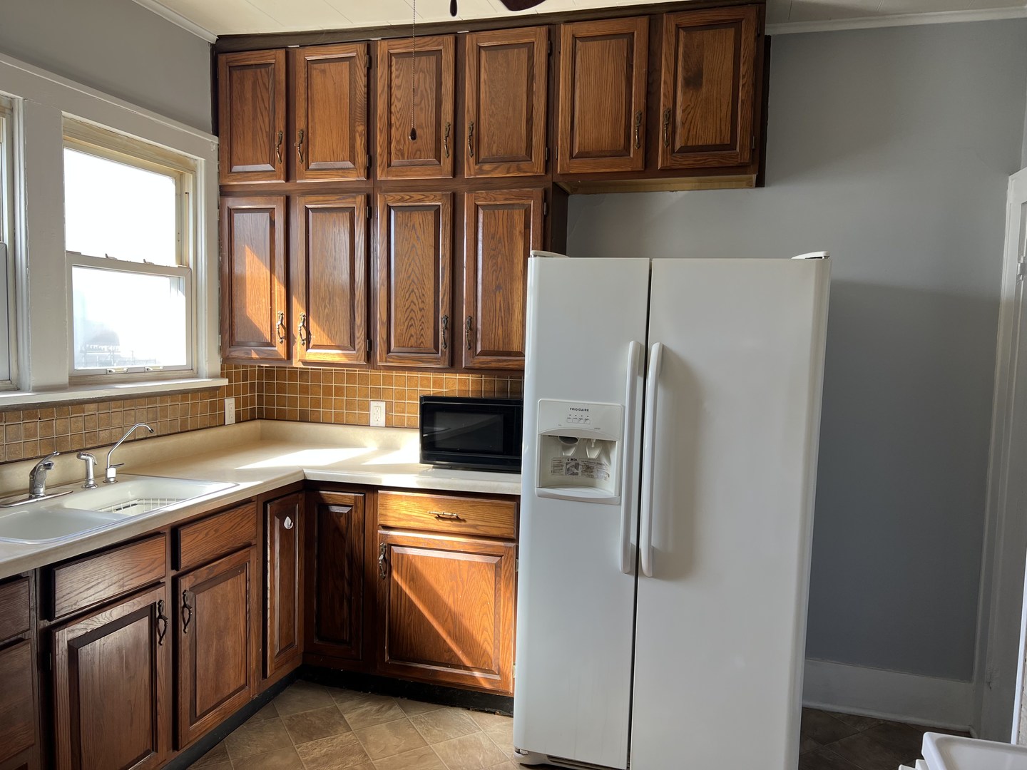 252 Ottawa Road Paxton, IL 60957 - Photo 10 of 14 a kitchen with stainless steel appliances granite countertop a refrigerator and a sink