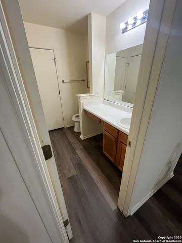 a bathroom with a sink a mirror and a toilet
