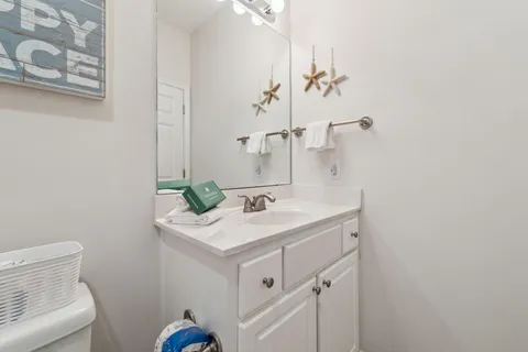 a bathroom with a shower a toilet and sink