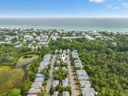 an aerial view of multiple houses with yard
