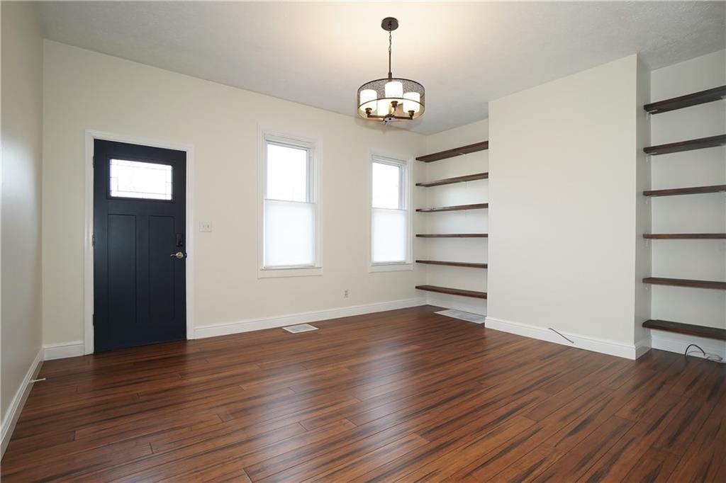 5266 Natrona Way Pittsburgh, PA 15201 - Photo 4 of 13 a view of a room with wooden floor and window