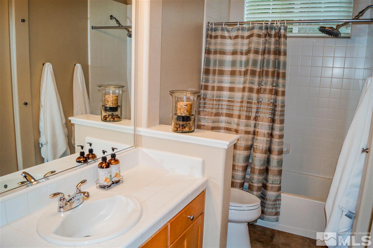 1725 Gold Belt Drive Reno, NV 89521 - Photo 17 of 23 a bathroom with a sink toilet and shower