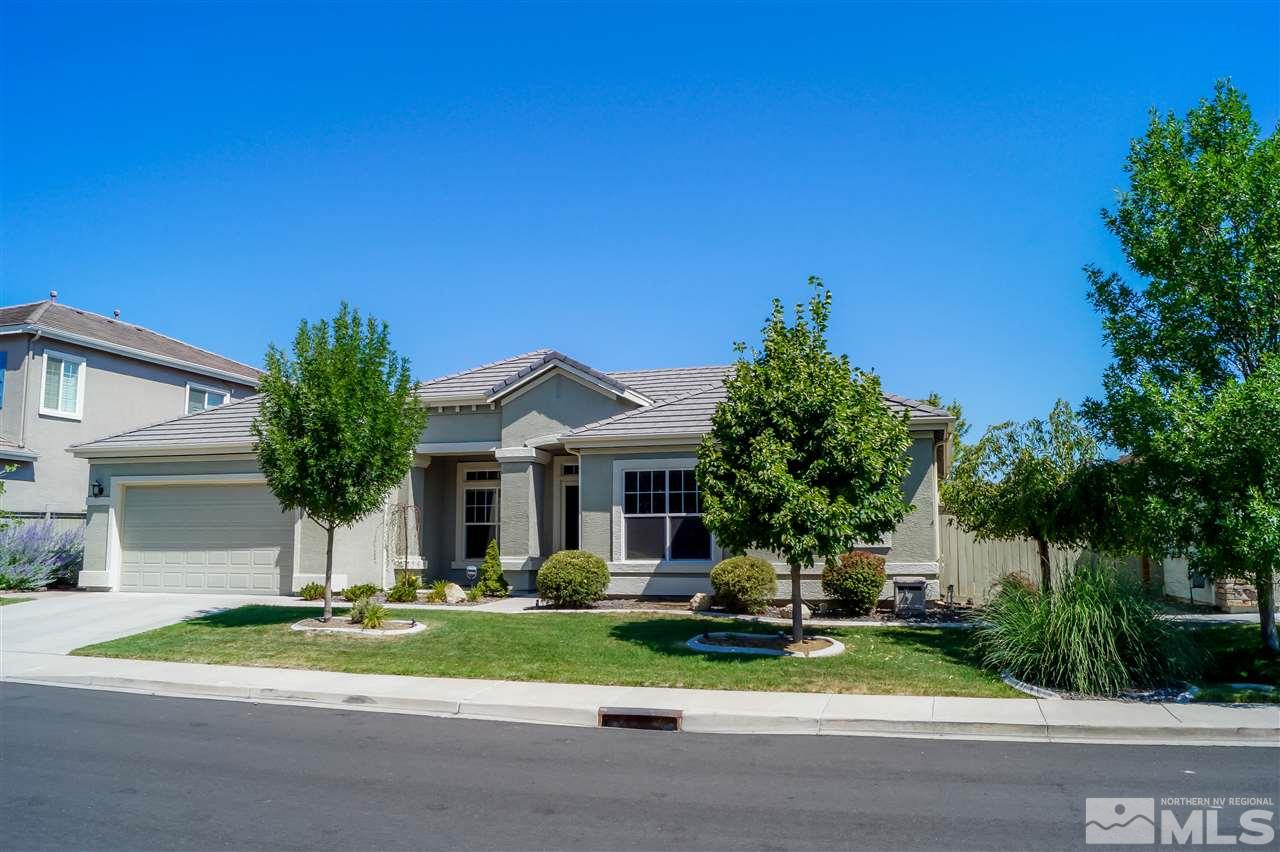 1725 Gold Belt Drive Reno, NV 89521 - Photo 4 of 23 a front view of a house with a yard and garage