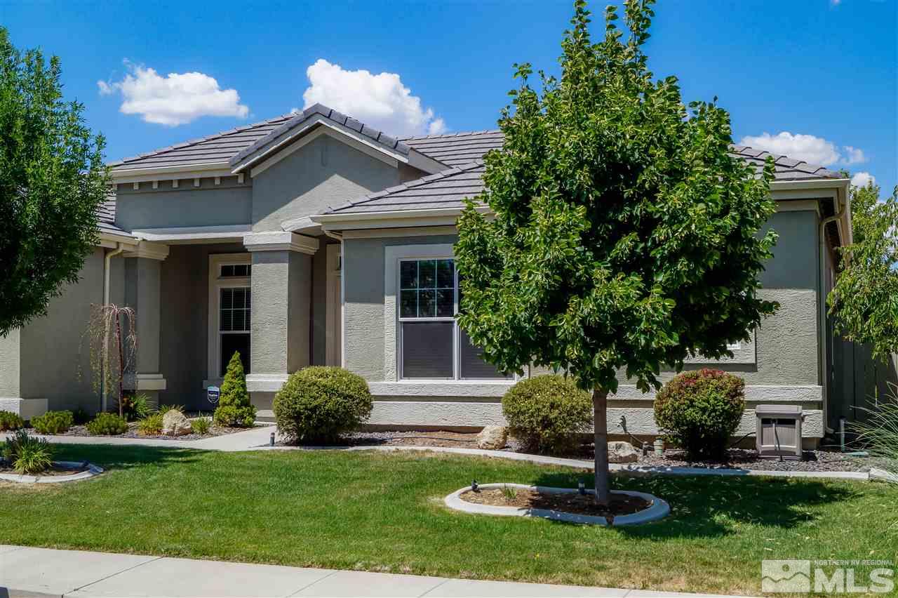 1725 Gold Belt Drive Reno, NV 89521 - Photo 5 of 23 a front view of a house with a yard and garage
