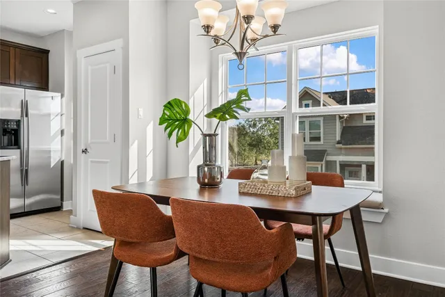 a view of a dining room with furniture window and wooden floor