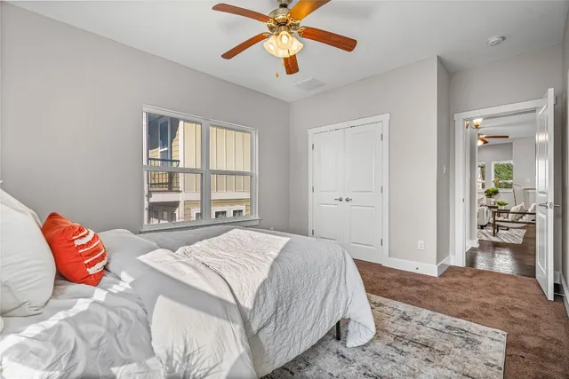 a bedroom with a bed and a dresser