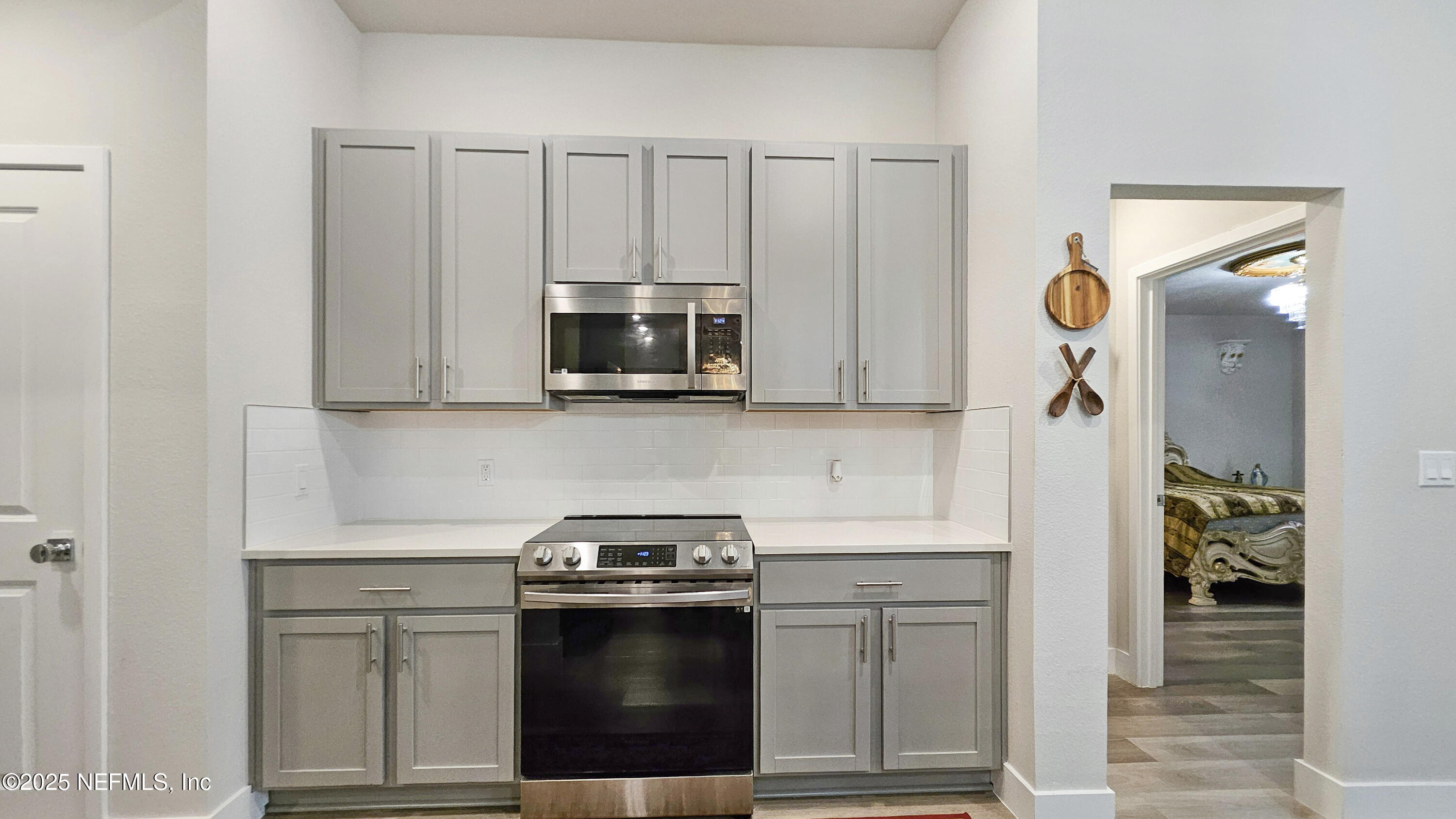 7 Smith Trail Palm Coast, FL 32164 - Photo 15 of 48 a kitchen with stainless steel appliances granite countertop a sink stove and microwave