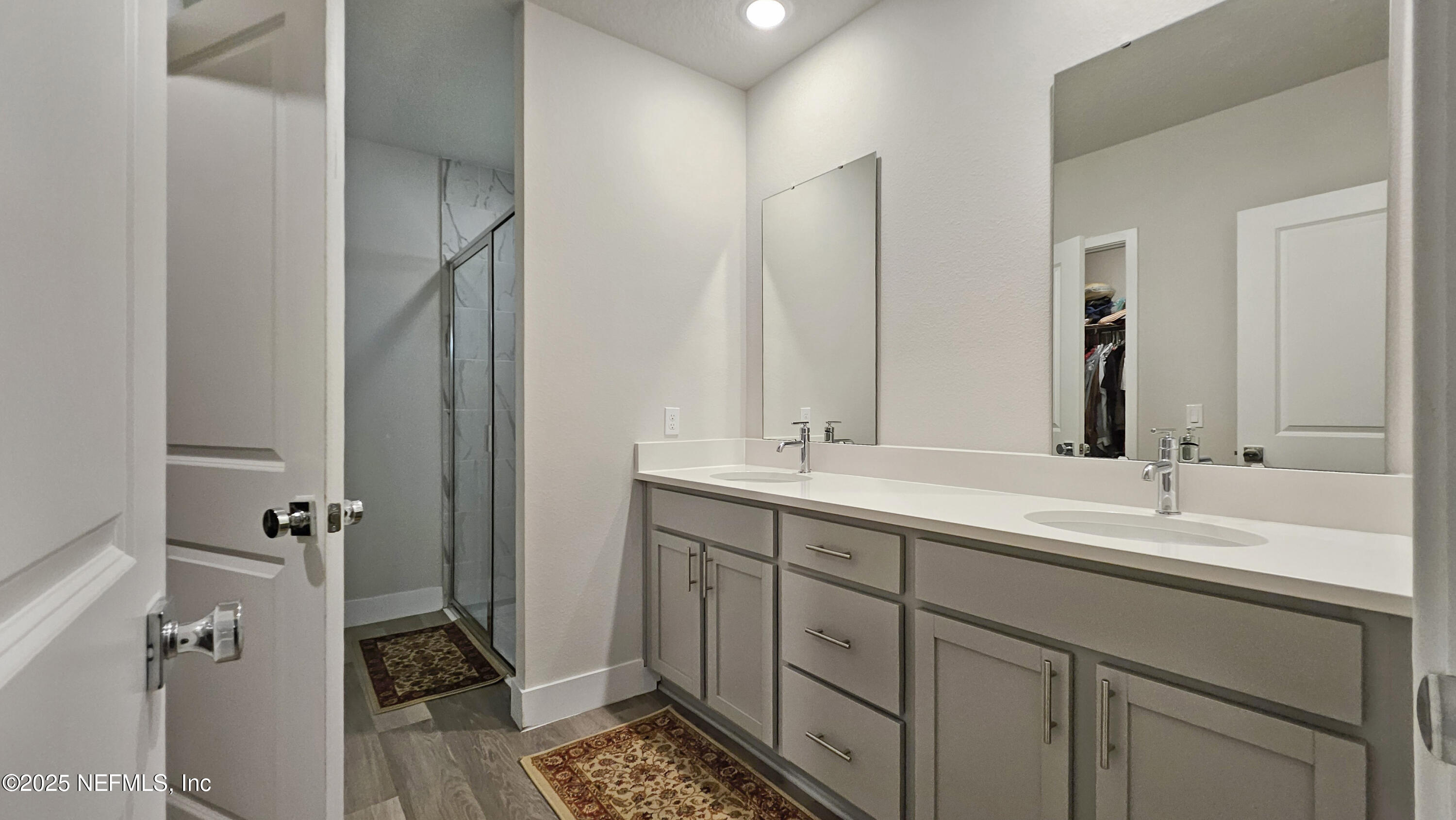 7 Smith Trail Palm Coast, FL 32164 - Photo 21 of 48 a bathroom with a double vanity sink and mirror