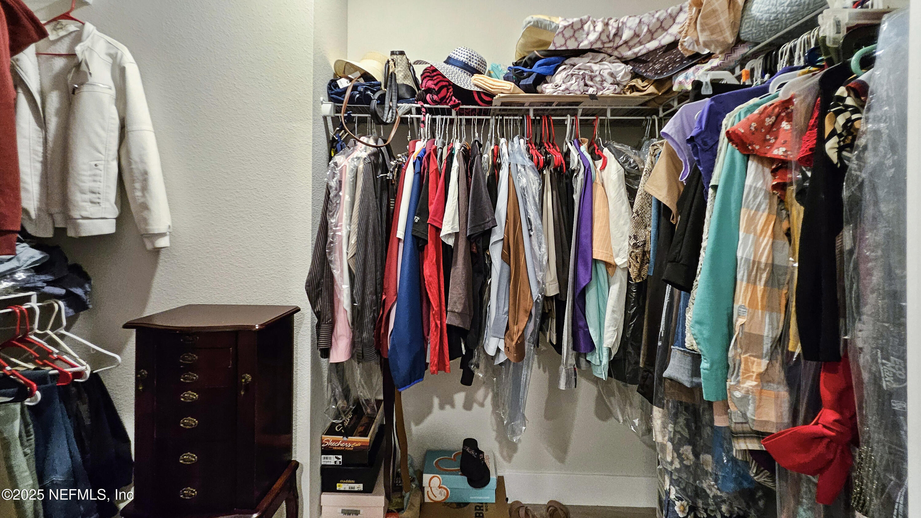 7 Smith Trail Palm Coast, FL 32164 - Photo 23 of 48 a view of walk in closet with clothes