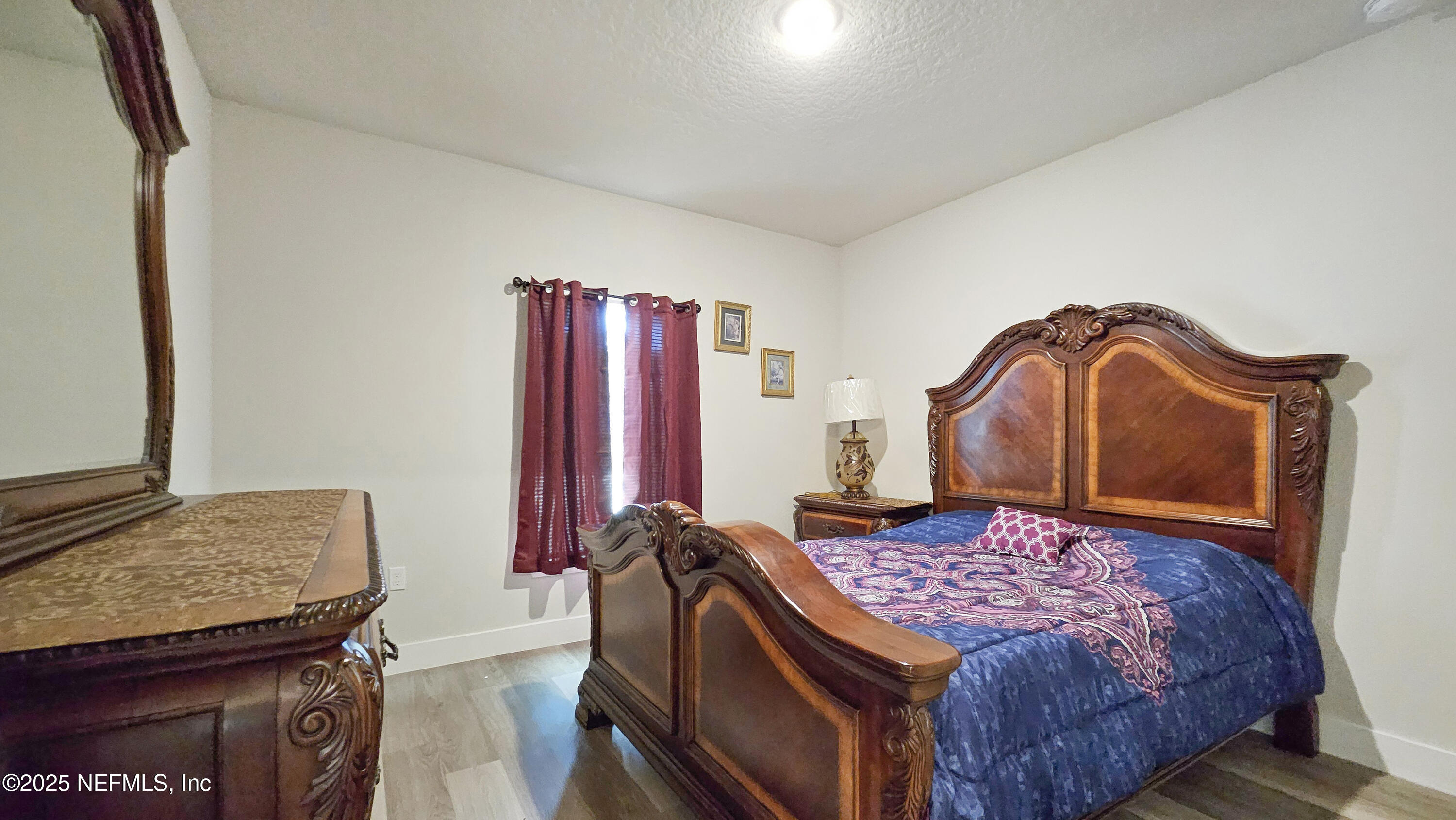 7 Smith Trail Palm Coast, FL 32164 - Photo 25 of 48 a bedroom with a bed and dresser