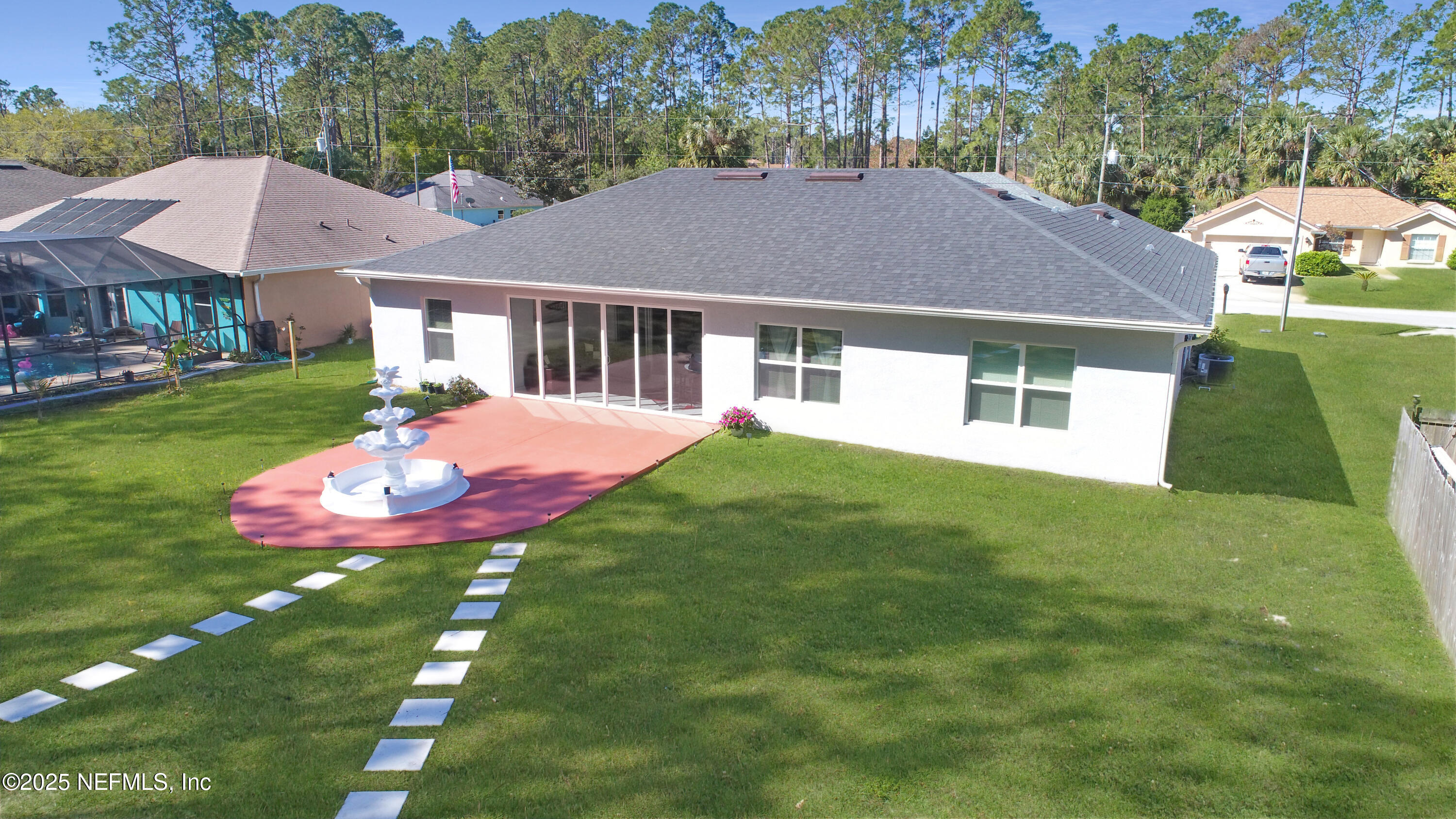 7 Smith Trail Palm Coast, FL 32164 - Photo 46 of 48 a view of a house with a backyard