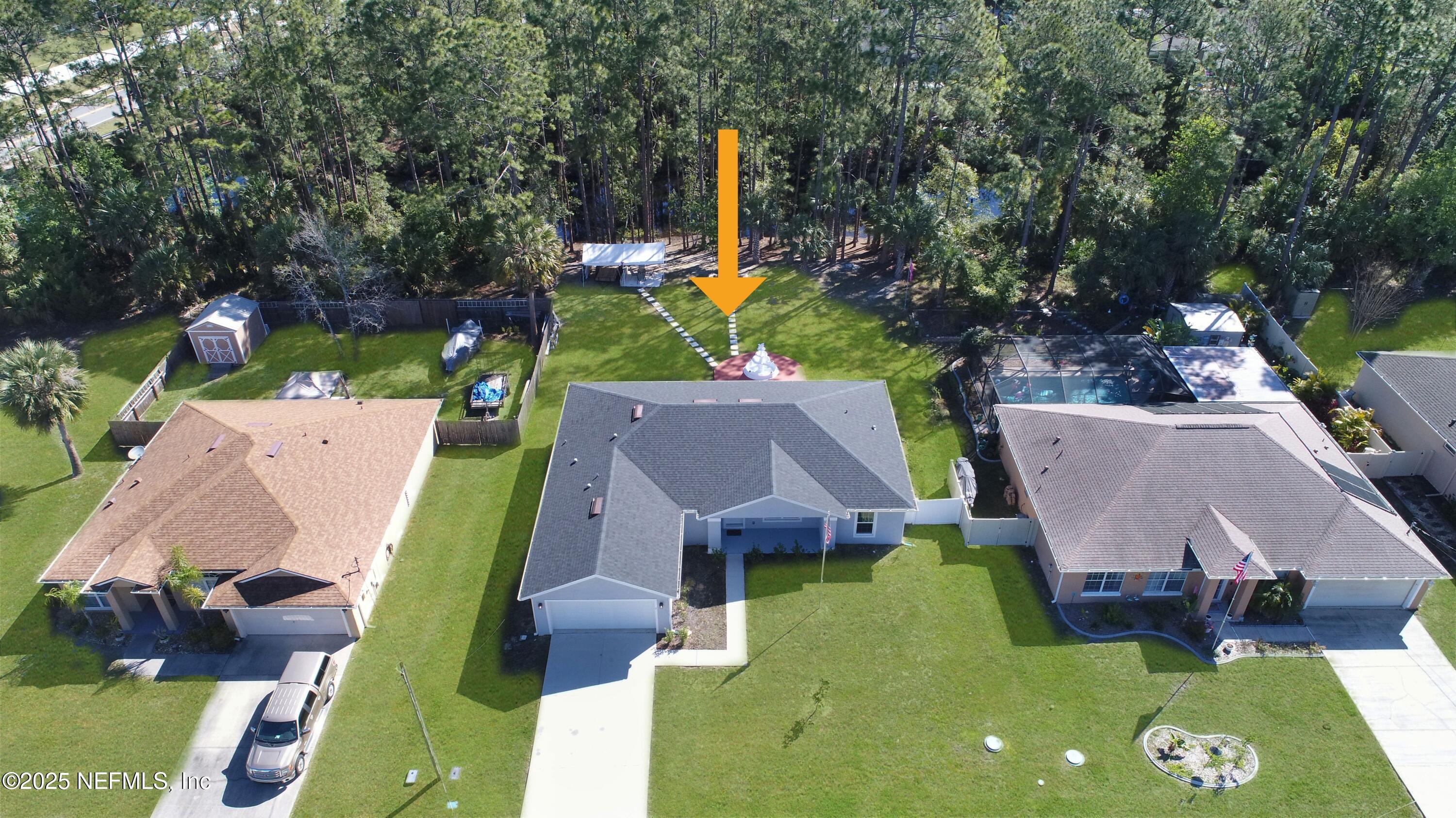 7 Smith Trail Palm Coast, FL 32164 - Photo 47 of 48 an aerial view of a house with swimming pool and big yard