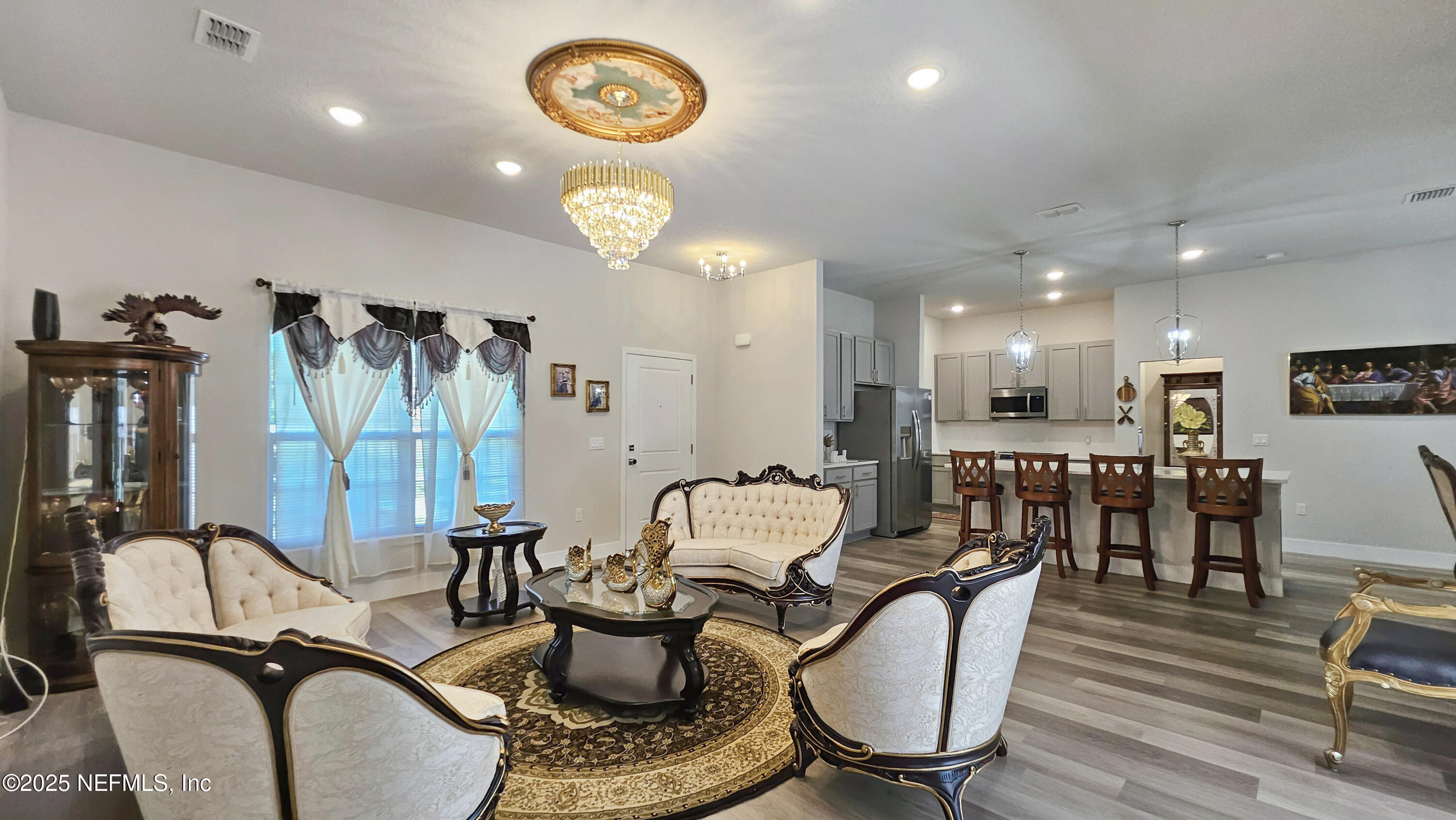 7 Smith Trail Palm Coast, FL 32164 - Photo 9 of 48 a living room with furniture a flat screen tv and kitchen view