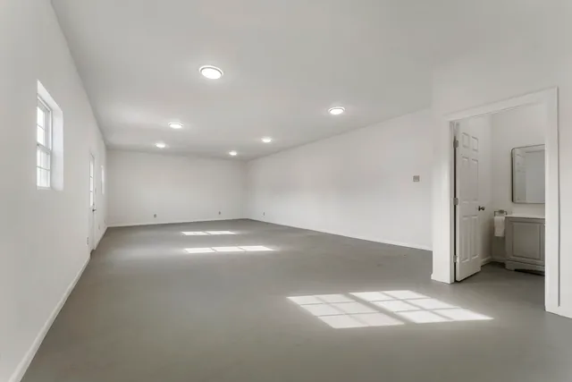 an empty room with a empty space and window
