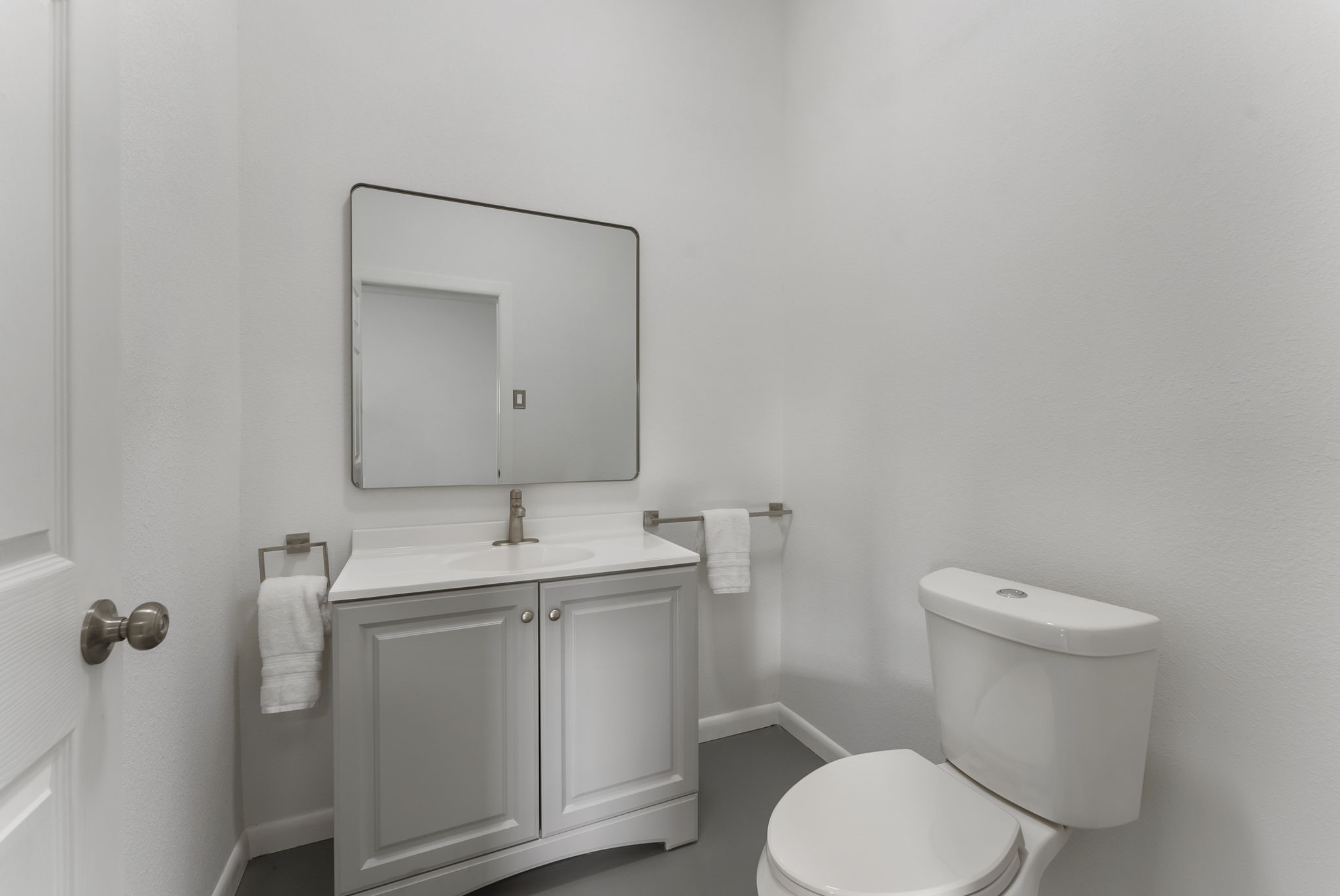 1635 Rayford Road Spring, TX 77386 - Photo 19 of 50 a bathroom with a toilet sink and mirror