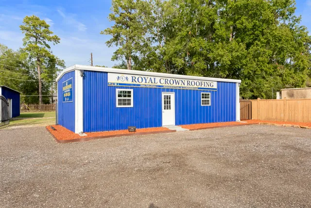 a view of a house with a backyard