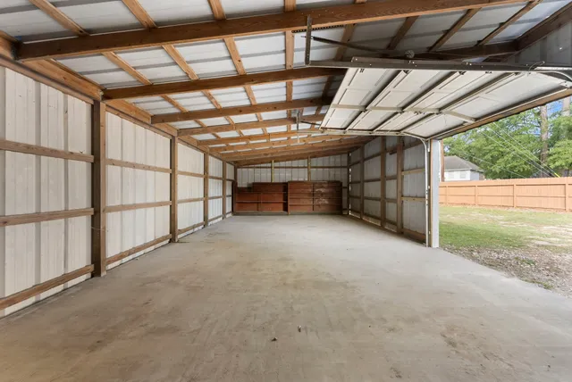 a view of empty room with wooden walls