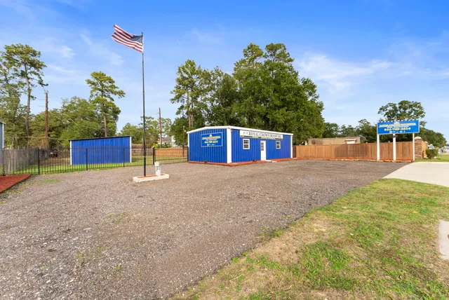 a view of a terrace with a wooden fence