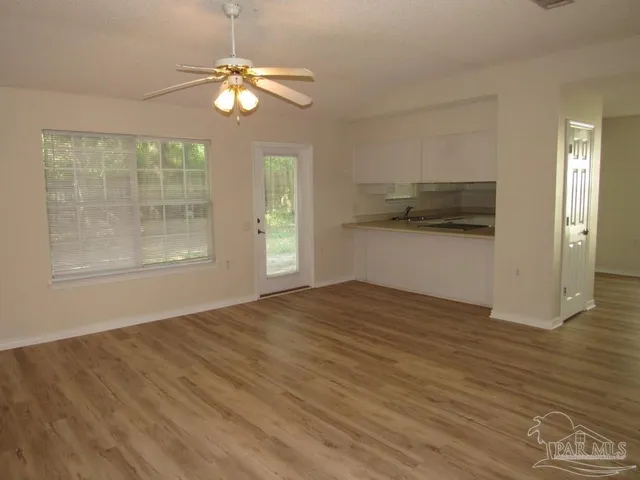 a view of an empty room with a window