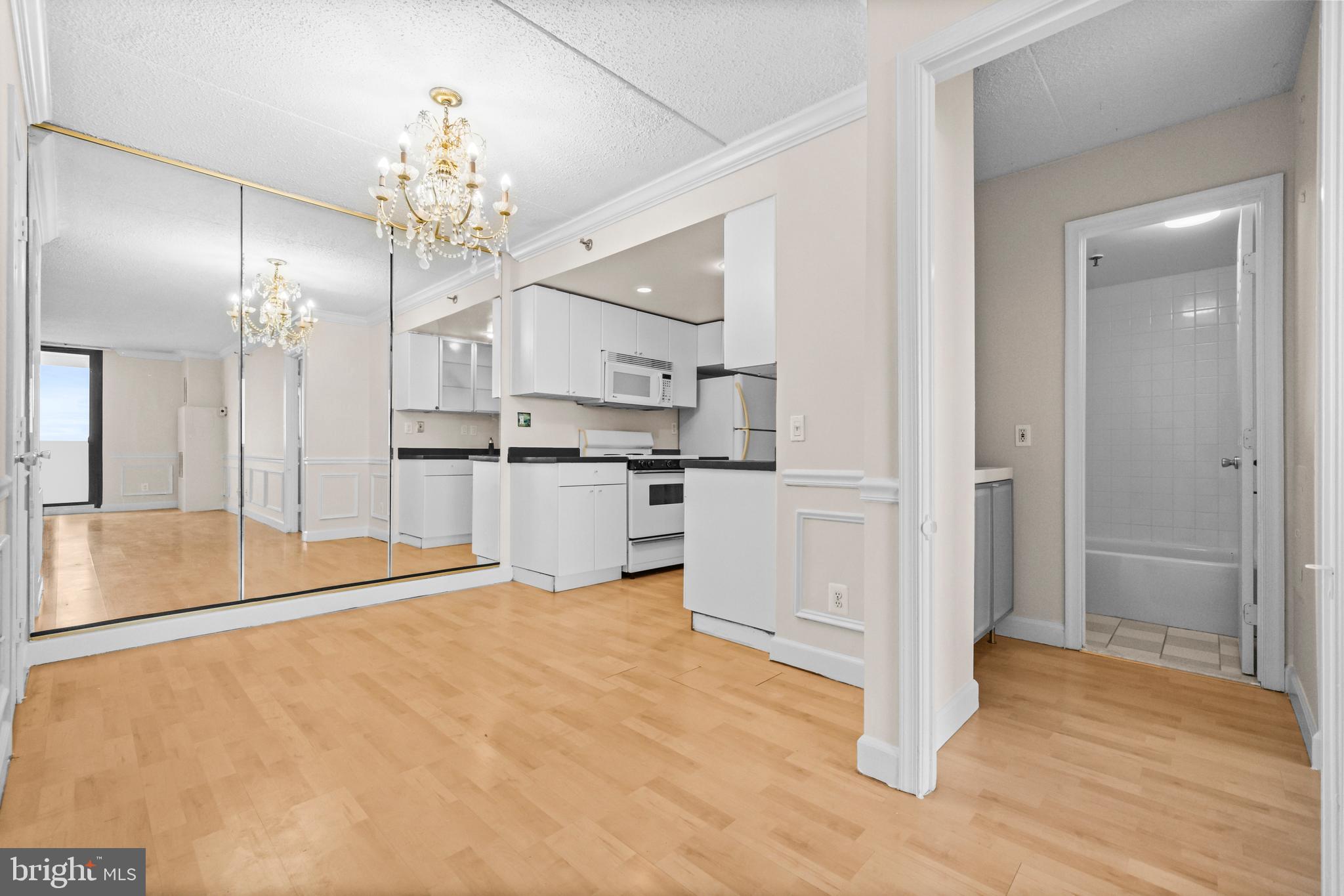 5911 Edsall Road, Unit 1209 Alexandria, VA 22304 - Photo 15 of 30 a large white kitchen with cabinets and stainless steel appliances