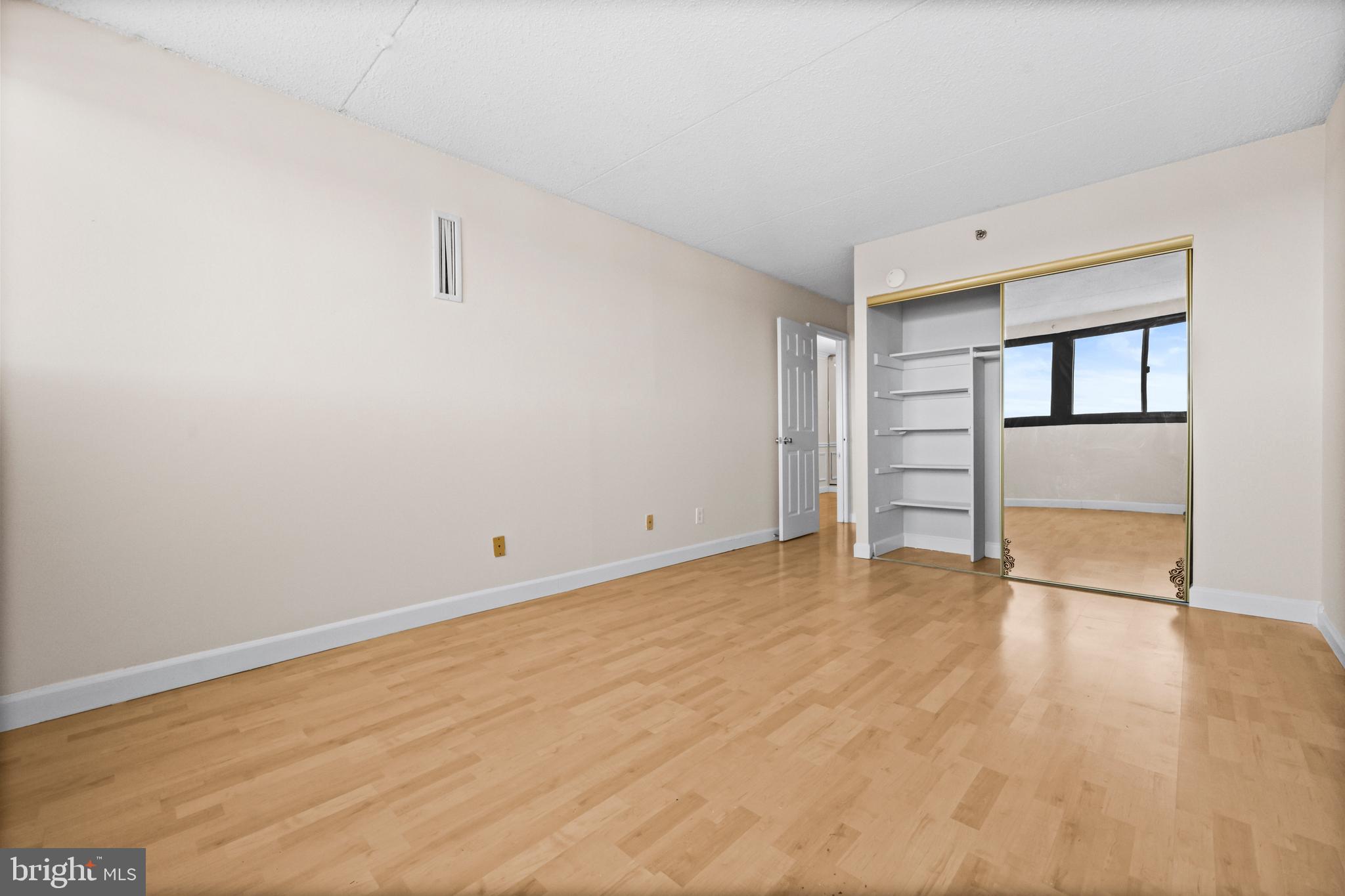 5911 Edsall Road, Unit 1209 Alexandria, VA 22304 - Photo 19 of 30 wooden floor in an empty room