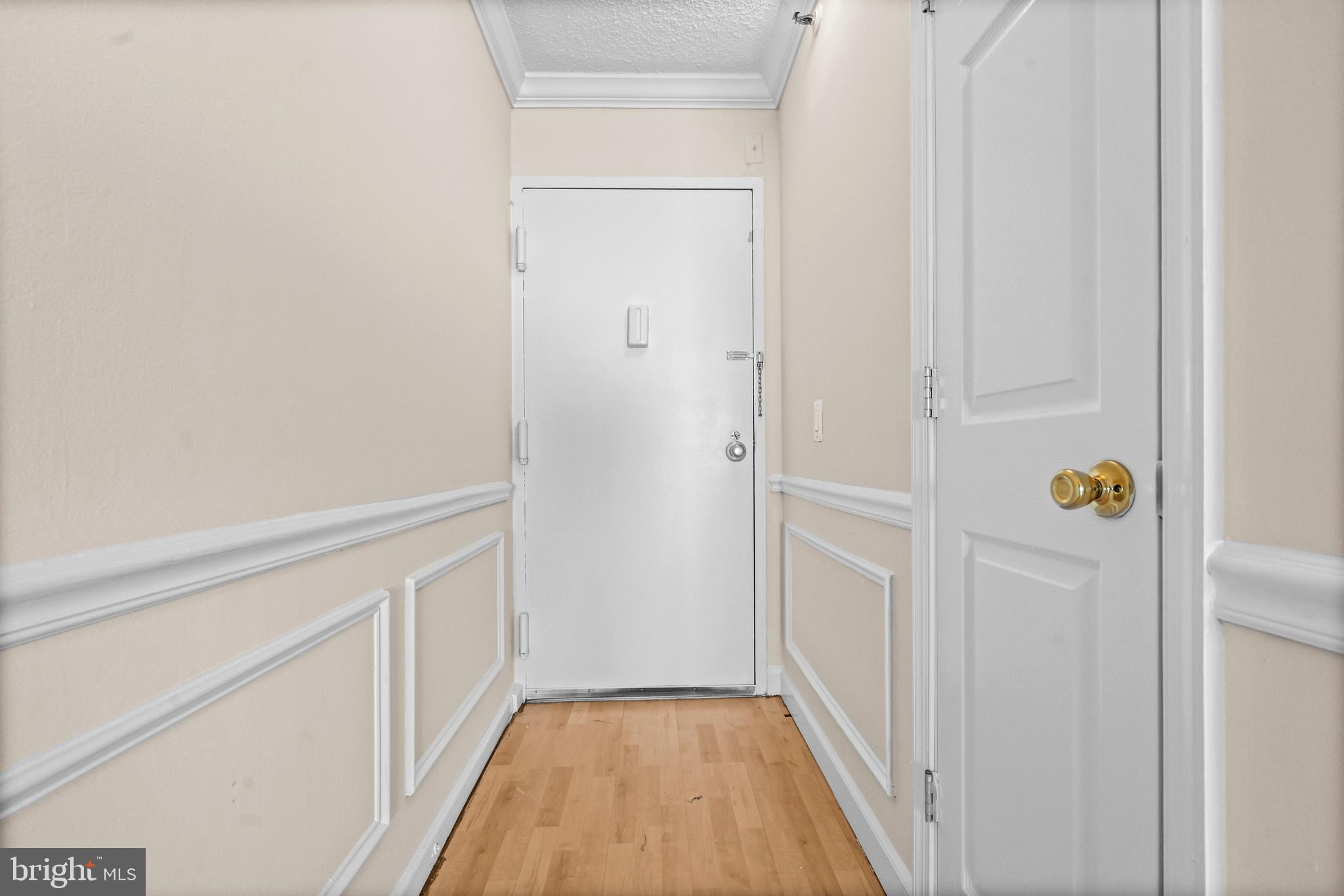 5911 Edsall Road, Unit 1209 Alexandria, VA 22304 - Photo 20 of 30 a view of a hallway with wooden floor