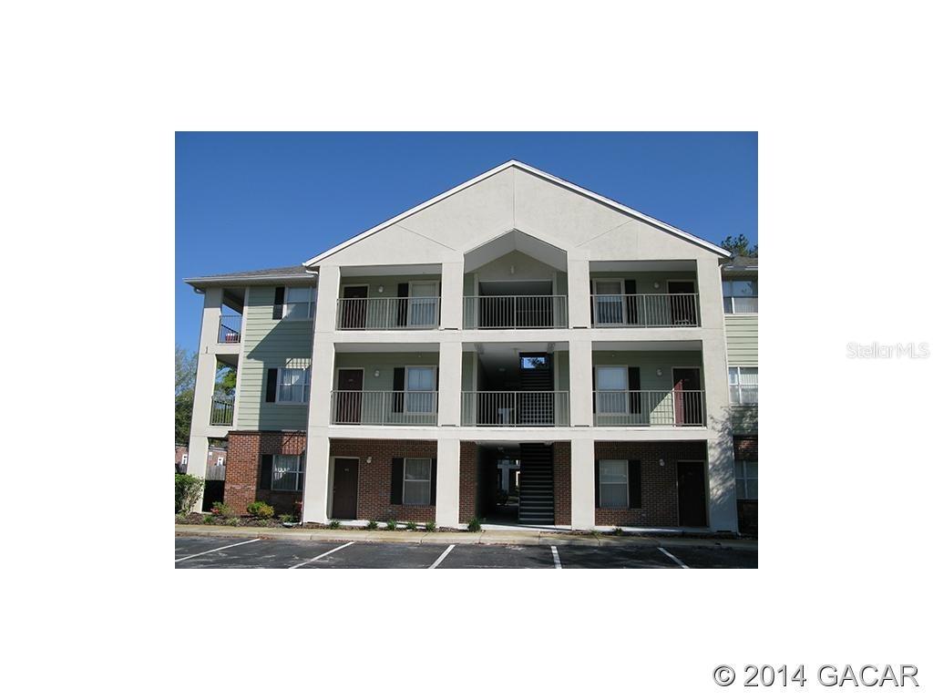 2360 Southwest Archer Road, Unit 109 Gainesville, FL 32608 - Photo 1 of 1 a black and white building with a outdoor space