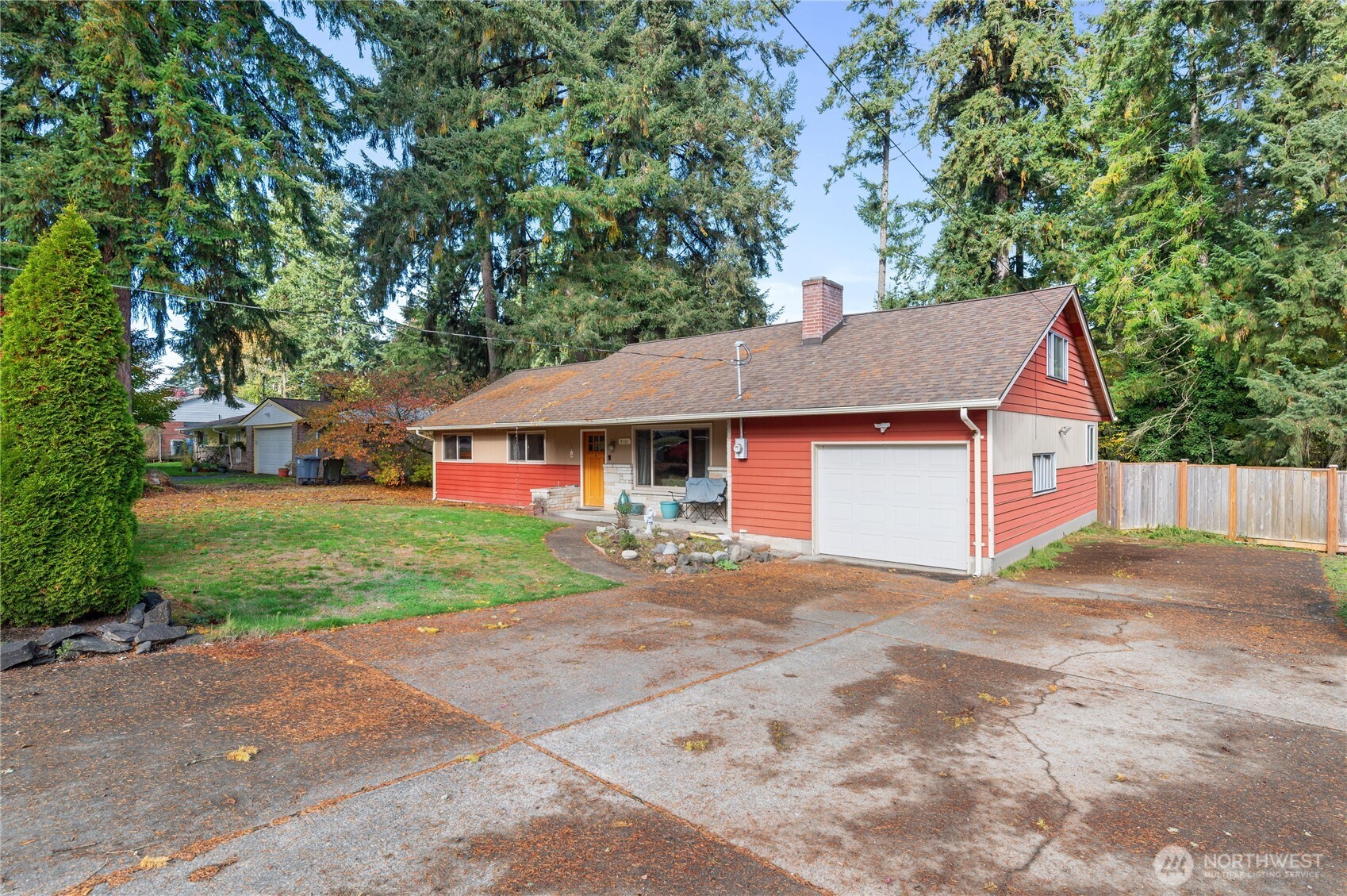 9101 112th Street Southwest Lakewood, WA 98498 - Photo 1 of 27 a front view of a house with a yard and garage