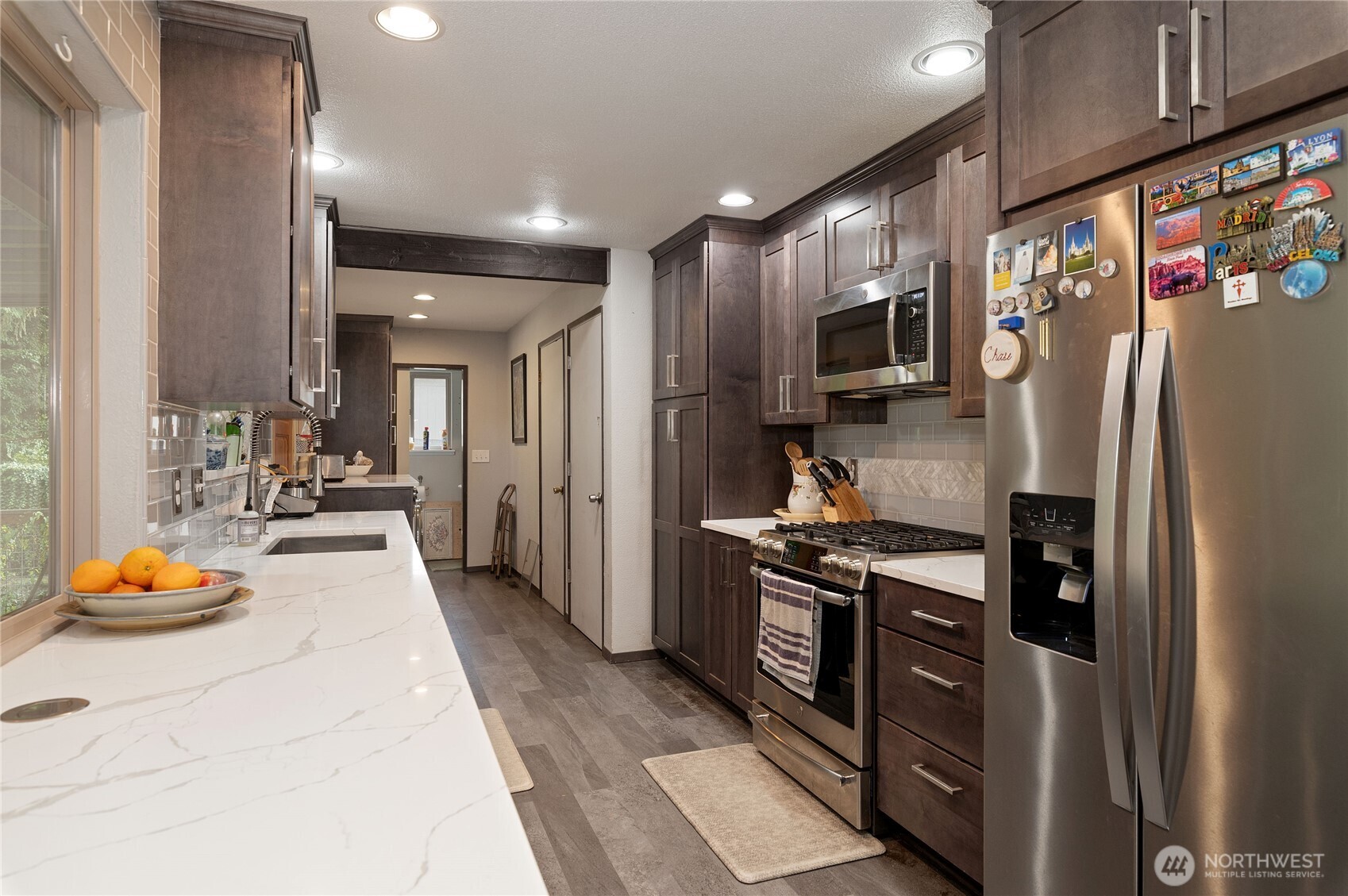 9101 112th Street Southwest Lakewood, WA 98498 - Photo 13 of 27 a kitchen with stainless steel appliances granite countertop a refrigerator a stove and a sink
