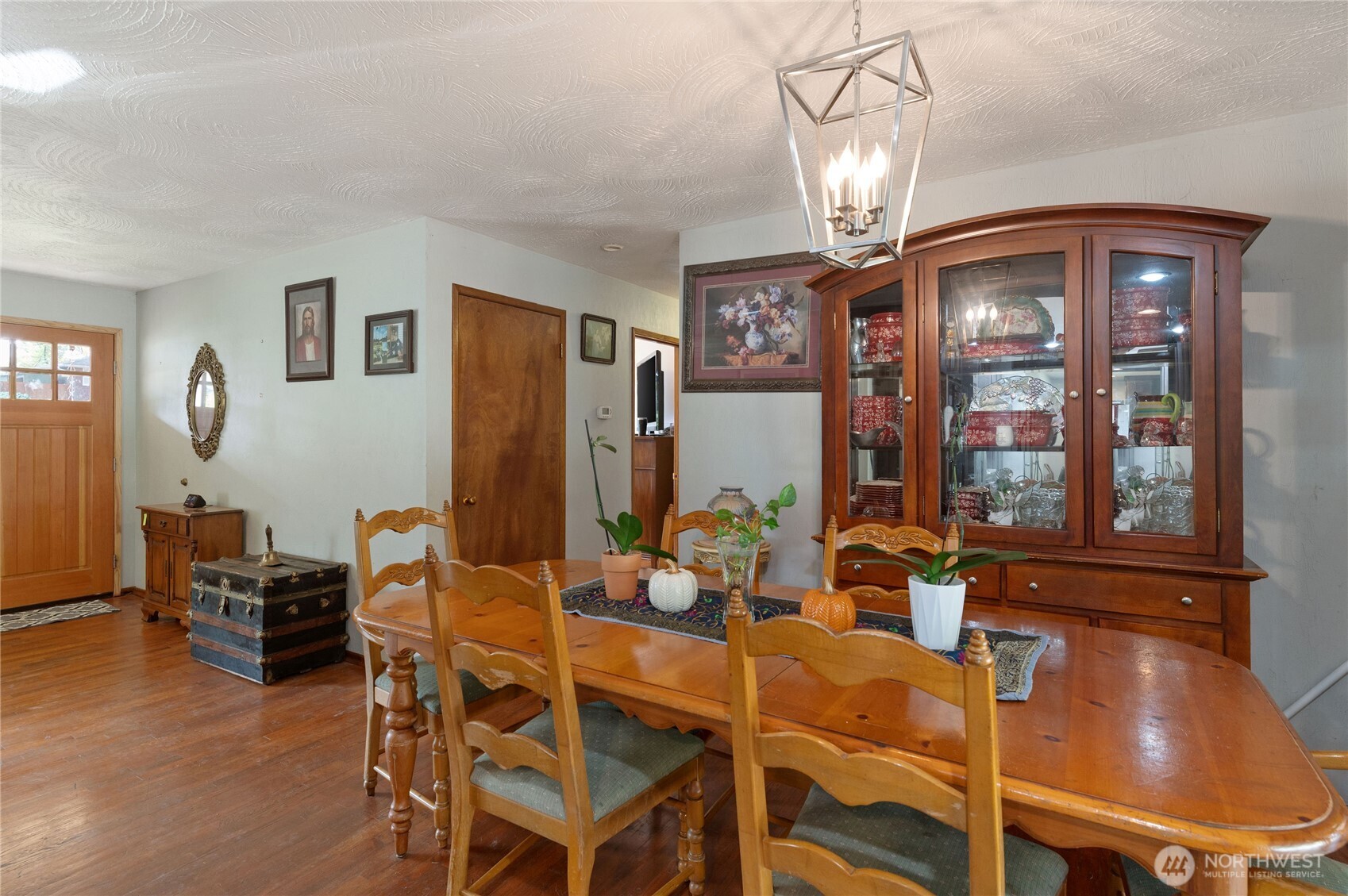 9101 112th Street Southwest Lakewood, WA 98498 - Photo 20 of 27 a view of a dining room with furniture and chandelier