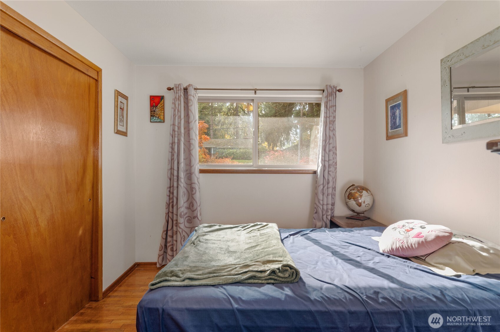 9101 112th Street Southwest Lakewood, WA 98498 - Photo 3 of 27 a bedroom with a bed and wooden floor