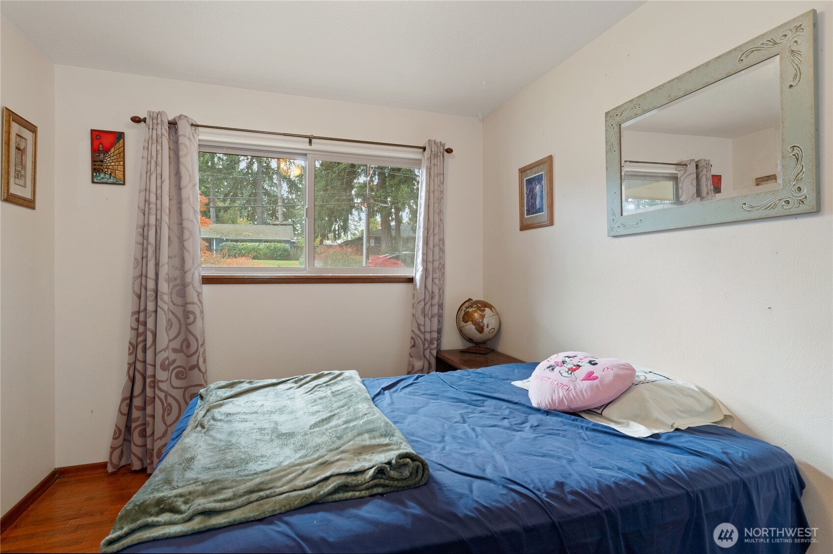 9101 112th Street Southwest Lakewood, WA 98498 - Photo 4 of 27 a bedroom with a bed and a window