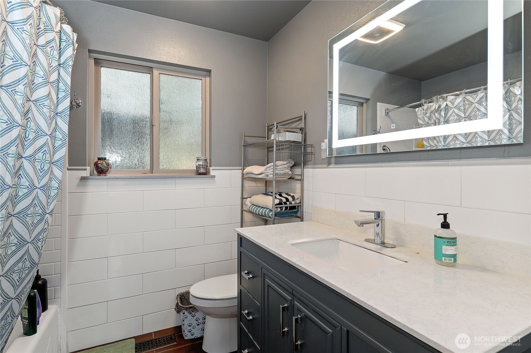 9101 112th Street Southwest Lakewood, WA 98498 - Photo 5 of 27 a bathroom with a sink a toilet and a shower