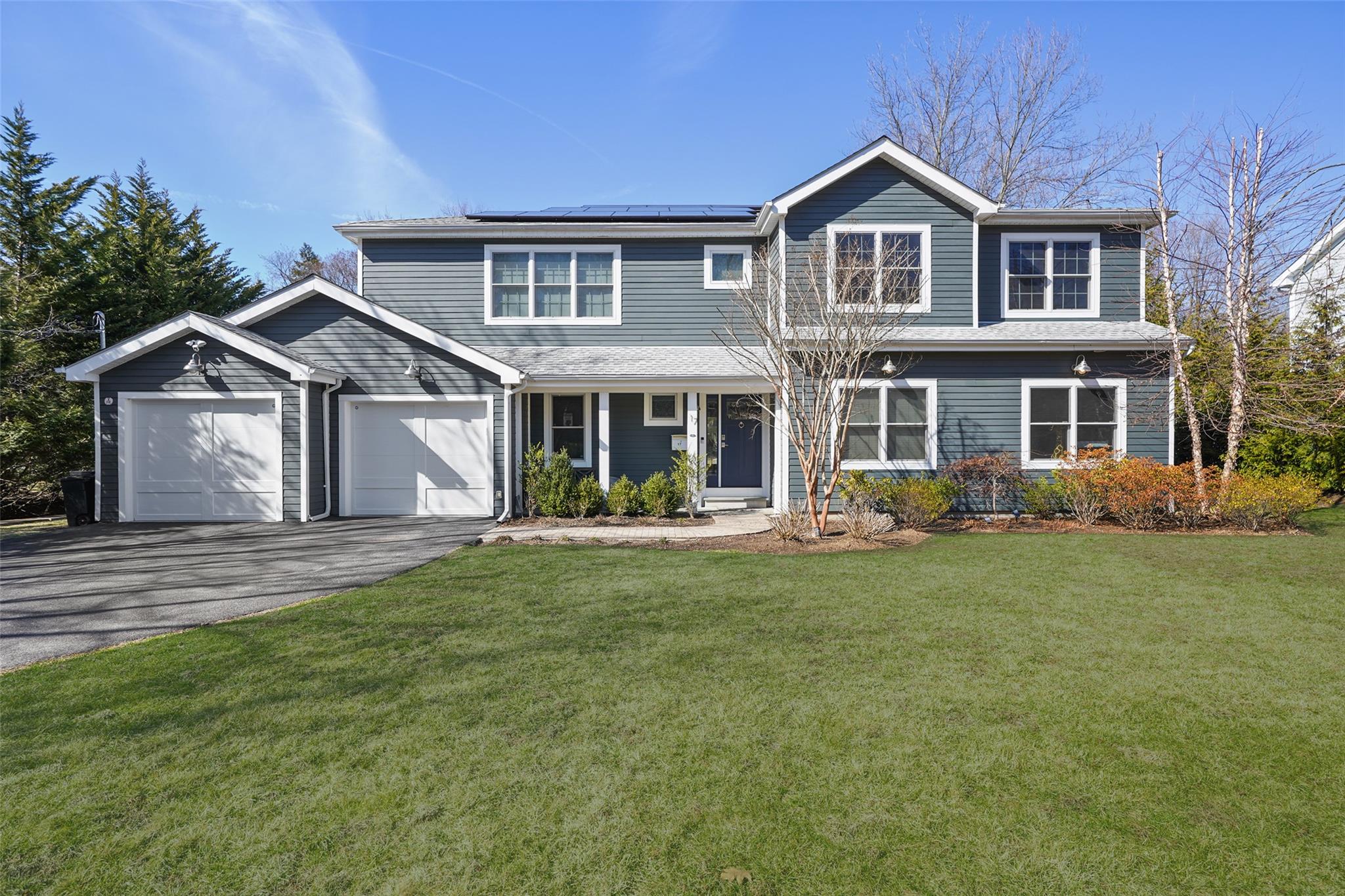 17 Loch Lane Rye Brook, NY 10573 - Photo 1 of 1 a front view of a house with a garden