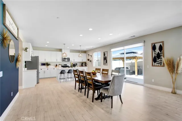 a view of a dining area with furniture and wooden floor