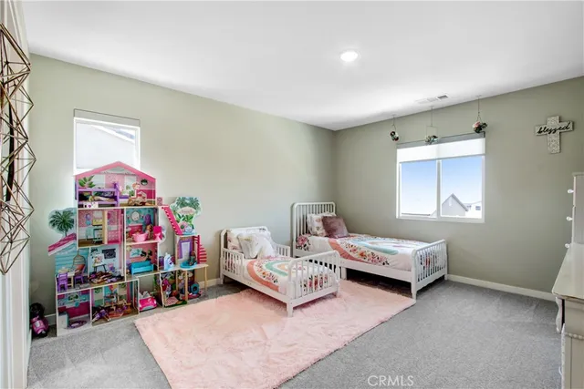 a bedroom with bed and a window