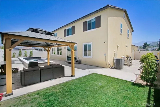 a front view of house with yard and seating area