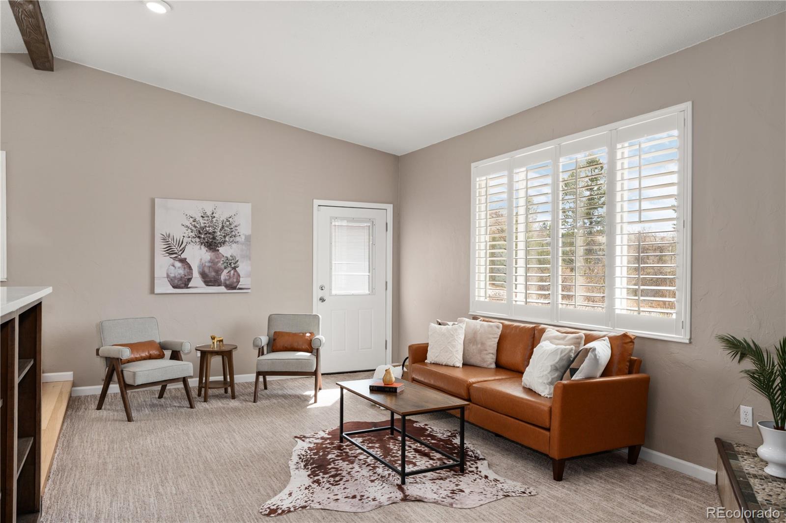 3920 Collins Street Castle Rock, CO 80108 - Photo 11 of 40 a living room with furniture and a large window