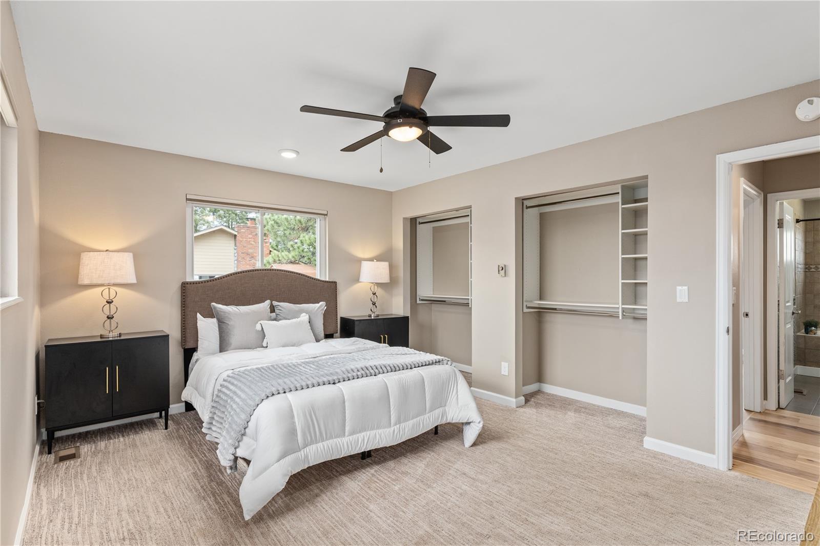 3920 Collins Street Castle Rock, CO 80108 - Photo 21 of 40 a bedroom with a bed and a lamp