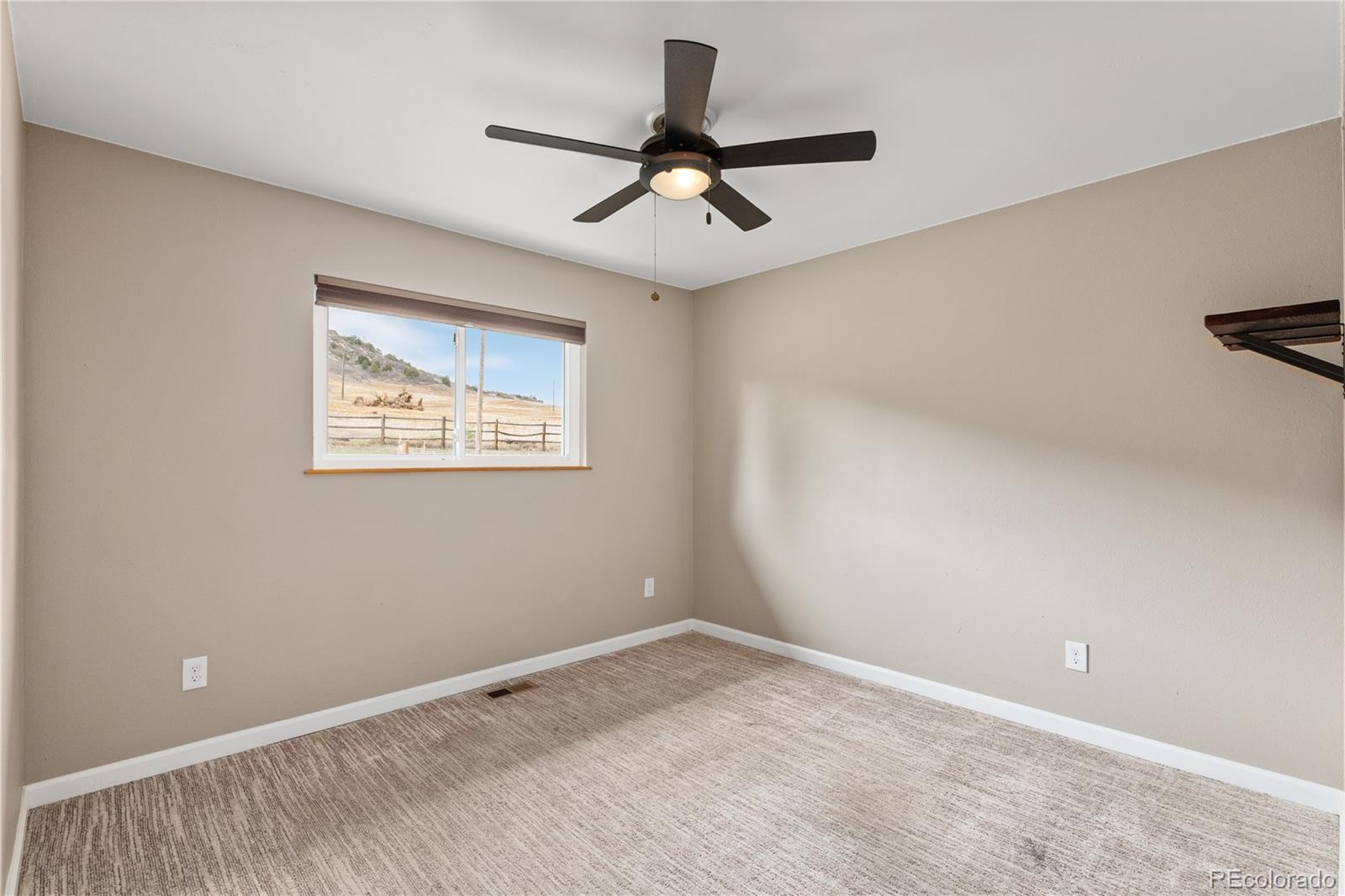 3920 Collins Street Castle Rock, CO 80108 - Photo 23 of 40 a view of room with ceiling fan