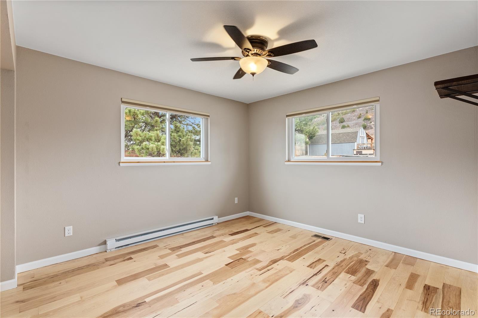 3920 Collins Street Castle Rock, CO 80108 - Photo 25 of 40 a view of a room with wooden floor and a window