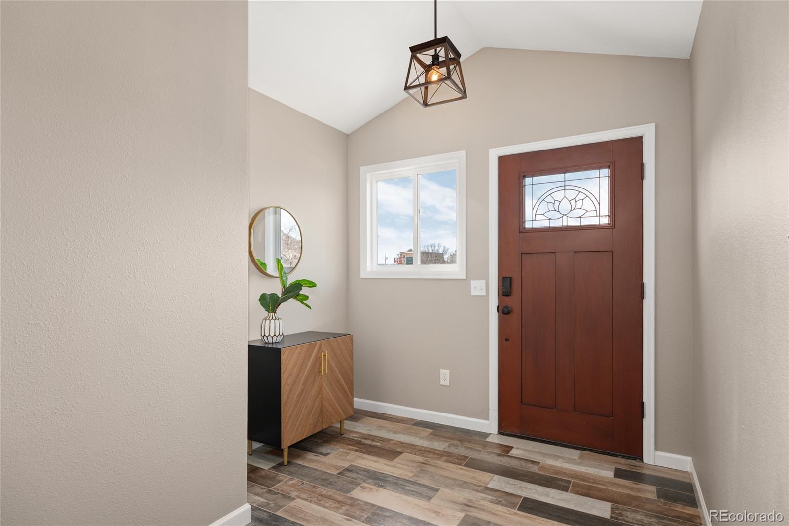 3920 Collins Street Castle Rock, CO 80108 - Photo 6 of 40 a view of an entryway with wooden floor