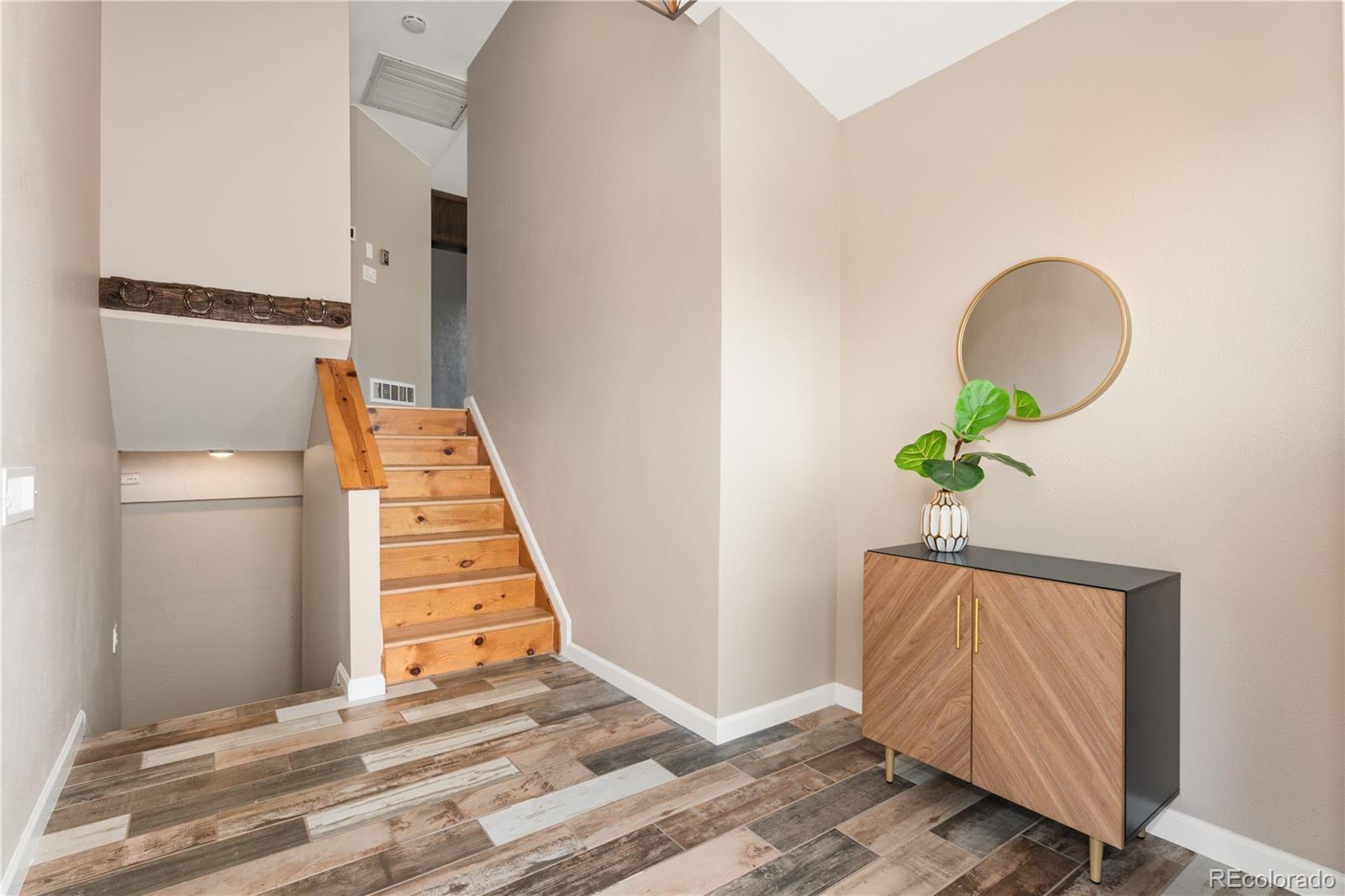 3920 Collins Street Castle Rock, CO 80108 - Photo 7 of 40 a view of entryway with wooden floor