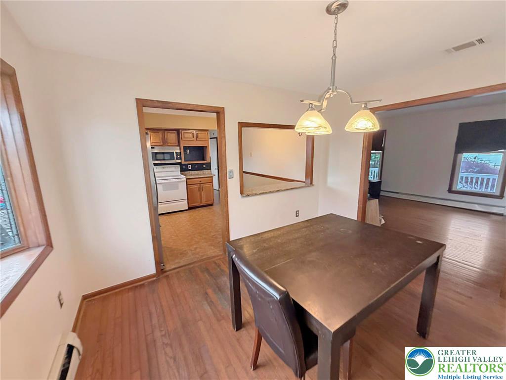 719 Hunter Street Catasauqua, PA 18032 - Photo 11 of 41 a kitchen with a table and chairs